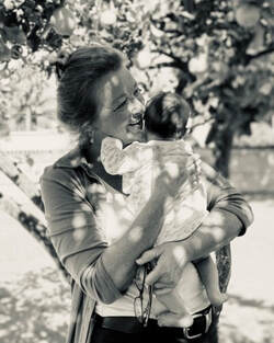 Terri Anne Cooper holding baby